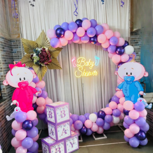 Premium dual theme baby shower decoration with pastel balloon arch, baby boy & girl standees and neon Baby Shower light