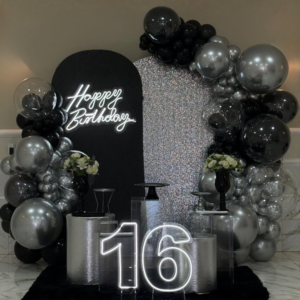 Premium black and silver birthday decoration with shimmer backdrop, balloon arch, Happy Birthday neon light and LED 16 numeric lighting