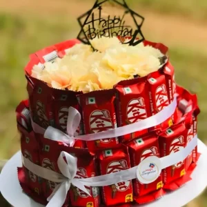 Two tier KitKat chocolate bouquet cake with ribbon wrapping and happy birthday topper