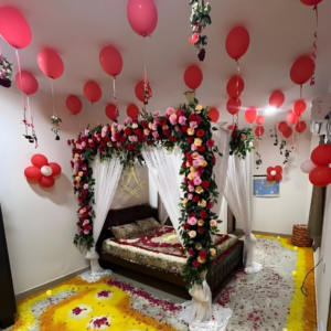 Royal Wedding First Night Room Decoration with Floral Canopy, Ceiling Balloons and Rose Petal Design