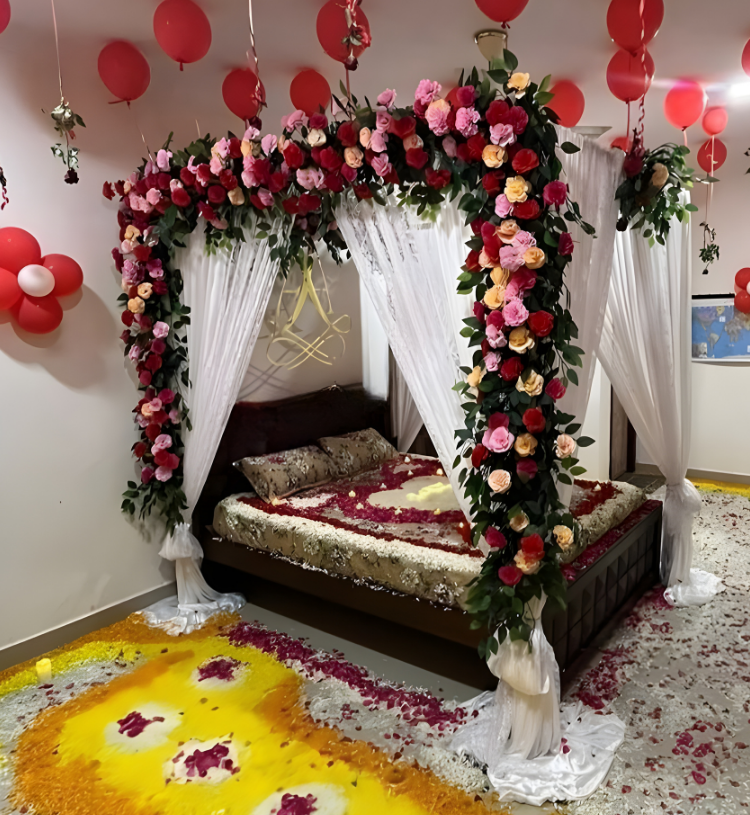 Royal Wedding First Night Room Decoration with Floral Canopy, Ceiling Balloons and Rose Petal Design