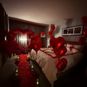 Luxury Romantic Red Heart Balloon & Rose Room Decoration with Candle Pathway and Floral Backdrop