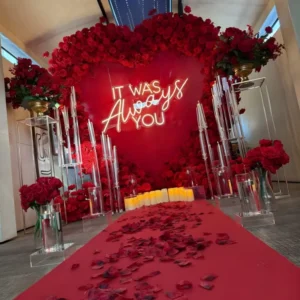 Luxury Romantic Heart Floral Proposal Decoration with “It Was Always You” Neon, Candles and Rose Petal Pathway